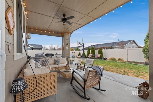 view of patio / terrace featuring a fenced backyard, ceiling fan, and an outdoor hangout area