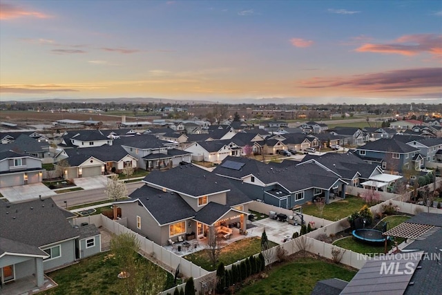 birds eye view of property with a residential view