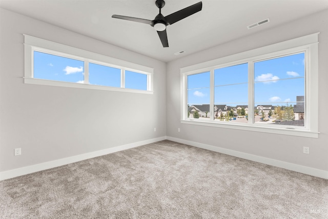6536 W Flathead Lake St, Eagle, ID 83616 - carpeted spare room featuring baseboards and a ceiling fan