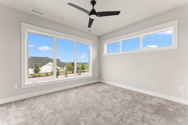 6536 W Flathead Lake St, Eagle, ID 83616 - carpeted spare room featuring baseboards and a ceiling fan