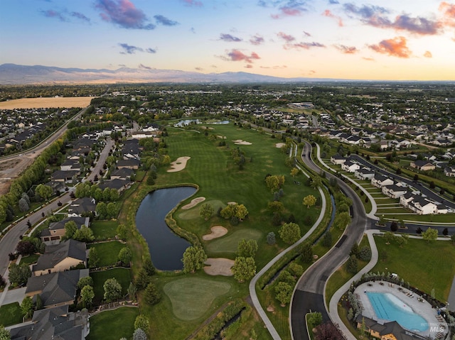 6536 W Flathead Lake St, Eagle, ID 83616 - aerial overview of property's location with a water and mountain view, nearby suburban area, and a local golf course