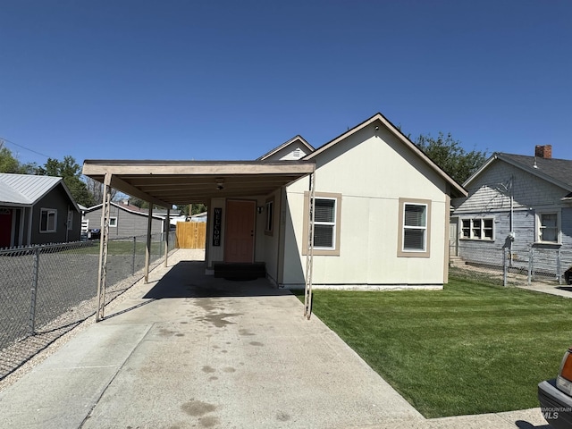 713 California St, Gooding, ID 83330 - view of front of home featuring a carport and concrete driveway
