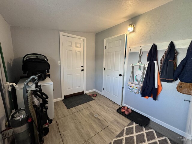 713 California St, Gooding, ID 83330 - entrance foyer with wood finished floors, a textured ceiling, and baseboards