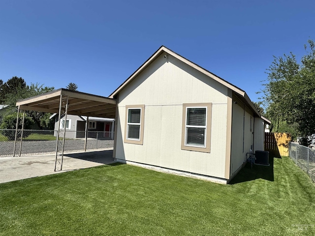 713 California St, Gooding, ID 83330 - view of home's exterior with central air condition unit and a carport