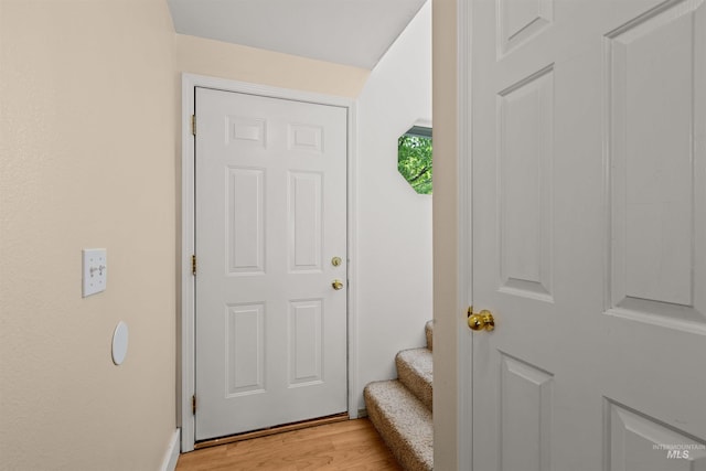 doorway with light wood-type flooring