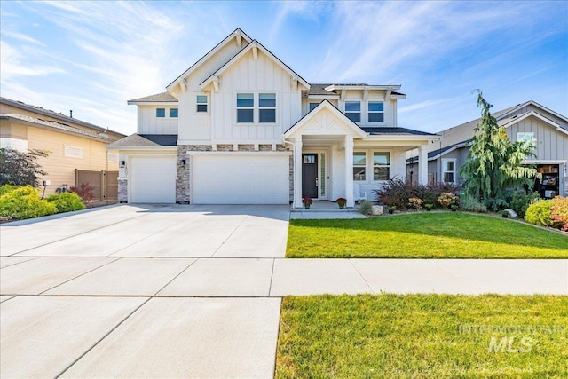 view of front of house with a front yard and a garage