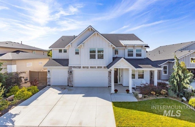 view of front of home featuring a garage and a front lawn