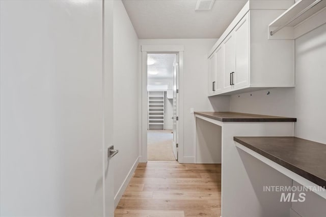 8506 W Graye St, Meridian, ID 83646 - laundry room with light wood-style floors and baseboards
