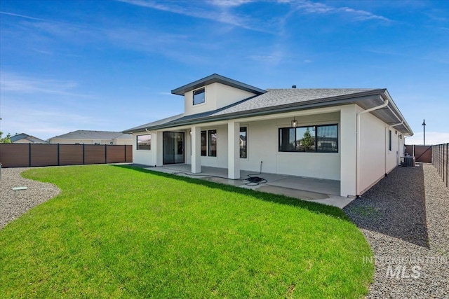 8506 W Graye St, Meridian, ID 83646 - back of property featuring central AC unit, stucco siding, a patio area, and a shingled roof