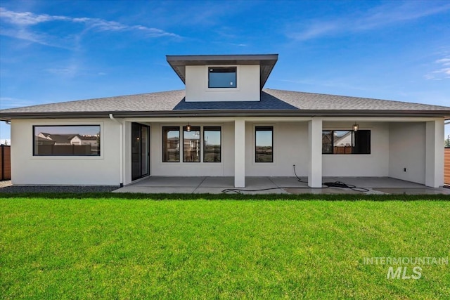 8506 W Graye St, Meridian, ID 83646 - back of property featuring stucco siding, roof with shingles, and a patio