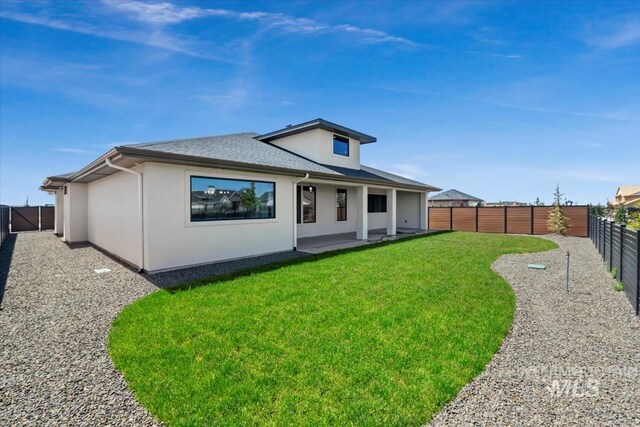 8506 W Graye St, Meridian, ID 83646 - rear view of property featuring stucco siding and roof with shingles