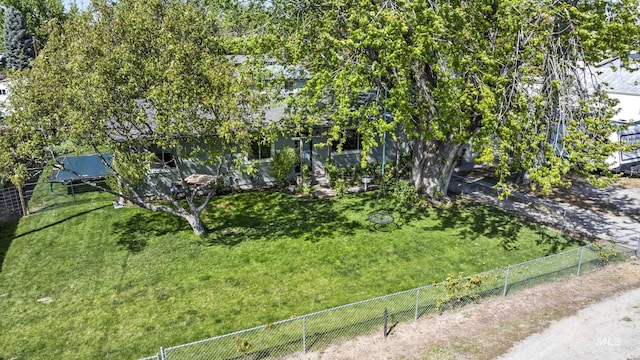 exterior space with a front lawn and fence