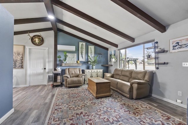living room with baseboards, vaulted ceiling with beams, a wall mounted air conditioner, and wood finished floors