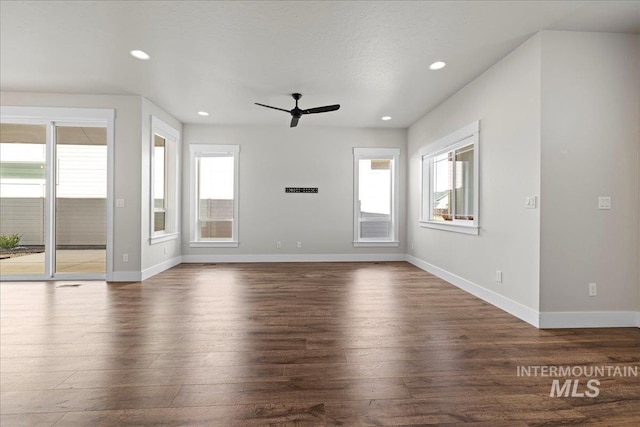 2187 E Hidcote St, Meridian, ID 83642 - unfurnished living room featuring ceiling fan, wood finished floors, baseboards, and recessed lighting