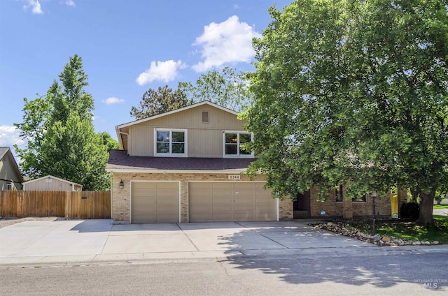 3344 N Tumbleweed, Boise, ID 83713 - view of front of house with brick siding, a garage, and concrete driveway