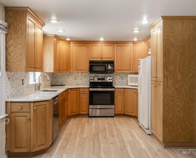 3344 N Tumbleweed, Boise, ID 83713 - kitchen featuring stainless steel appliances, light wood-style floors, backsplash, a sink, and recessed lighting