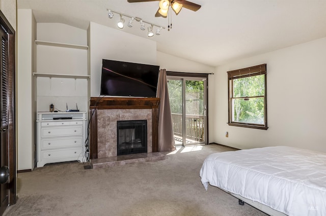 3344 N Tumbleweed, Boise, ID 83713 - carpeted bedroom featuring vaulted ceiling, access to outside, a tile fireplace, rail lighting, and baseboards