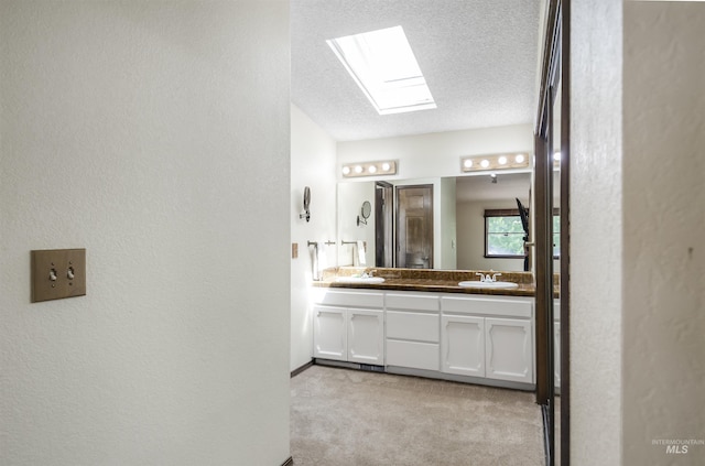 3344 N Tumbleweed, Boise, ID 83713 - full bath featuring double vanity, a skylight, a textured wall, and a textured ceiling