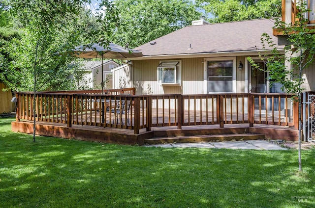 3344 N Tumbleweed, Boise, ID 83713 - back of property with a chimney, a deck, roof with shingles, and a lawn