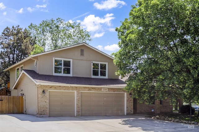 3344 N Tumbleweed, Boise, ID 83713 - view of front of home featuring an attached garage, brick siding, and concrete driveway