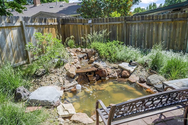 3344 N Tumbleweed, Boise, ID 83713 - fenced backyard with a small pond