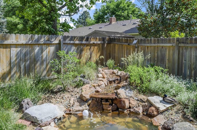 3344 N Tumbleweed, Boise, ID 83713 - fenced backyard with a garden pond