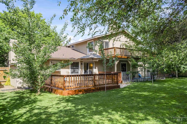 3344 N Tumbleweed, Boise, ID 83713 - rear view of property with a lawn, a deck, a shingled roof, and stucco siding