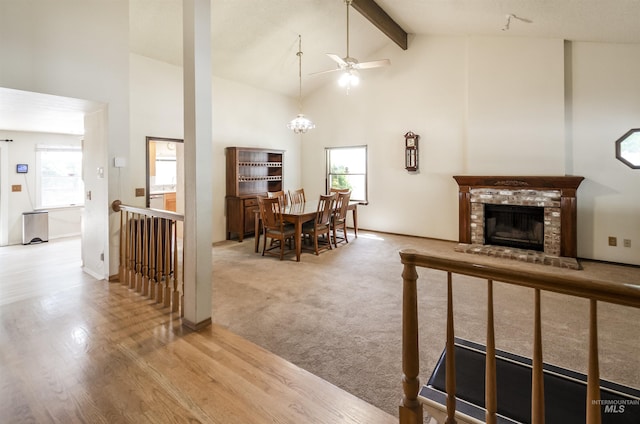 3344 N Tumbleweed, Boise, ID 83713 - dining area featuring high vaulted ceiling, ceiling fan, beam ceiling, a brick fireplace, and wood finished floors