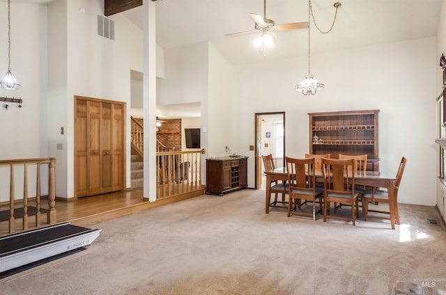 3344 N Tumbleweed, Boise, ID 83713 - dining space featuring high vaulted ceiling, ceiling fan, stairs, and carpet
