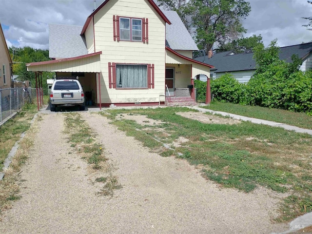 front facade with a carport