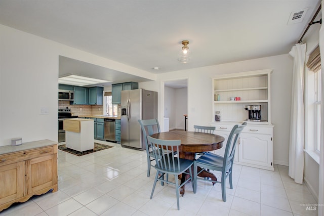 1214 E Pennsylvania Pl, Nampa, ID 83686 - dining area with light tile patterned floors and baseboards
