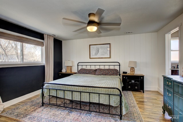 1214 E Pennsylvania Pl, Nampa, ID 83686 - bedroom featuring multiple windows, light wood finished floors, ceiling fan, and baseboards