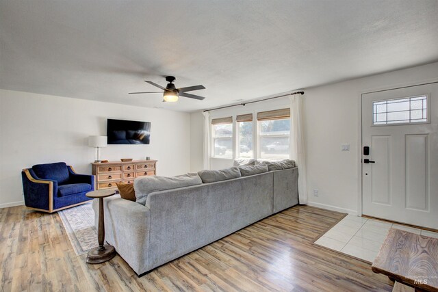 1214 E Pennsylvania Pl, Nampa, ID 83686 - living room featuring a ceiling fan, light wood-style flooring, and baseboards