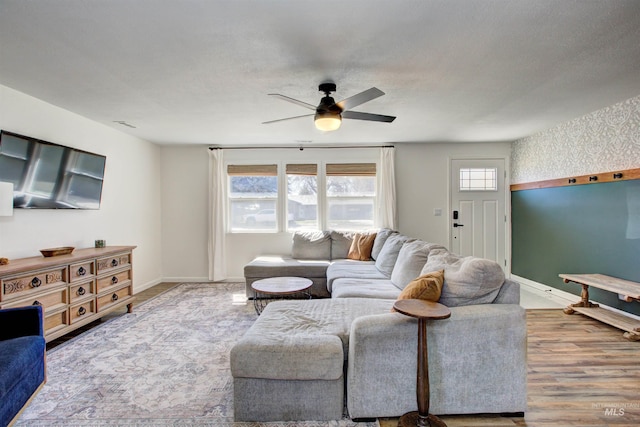 1214 E Pennsylvania Pl, Nampa, ID 83686 - living room with ceiling fan, baseboards, and wood finished floors