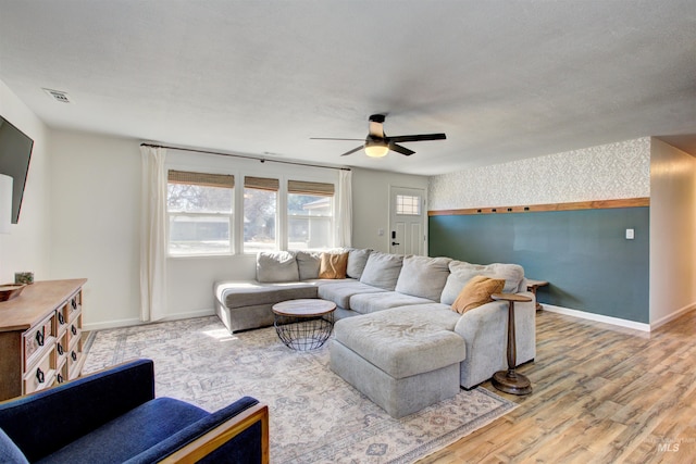 1214 E Pennsylvania Pl, Nampa, ID 83686 - living room featuring a ceiling fan, baseboards, wood finished floors, and wallpapered walls