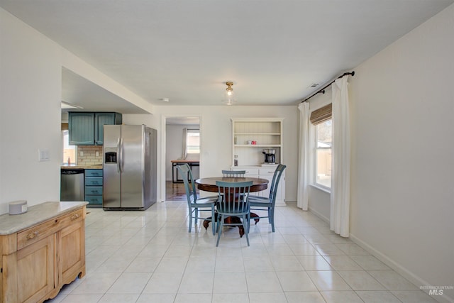 1214 E Pennsylvania Pl, Nampa, ID 83686 - dining area with baseboards and light tile patterned floors