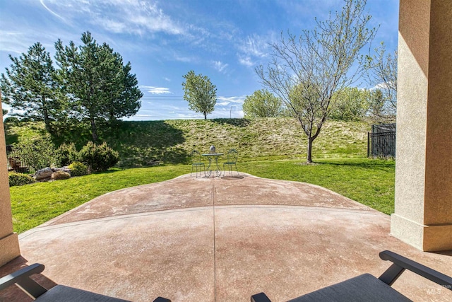 view of patio / terrace featuring fence