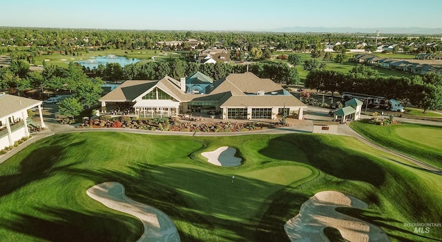 aerial view with a residential view, a water view, and golf course view