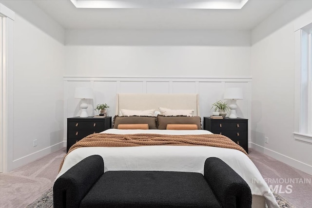 carpeted bedroom with a skylight