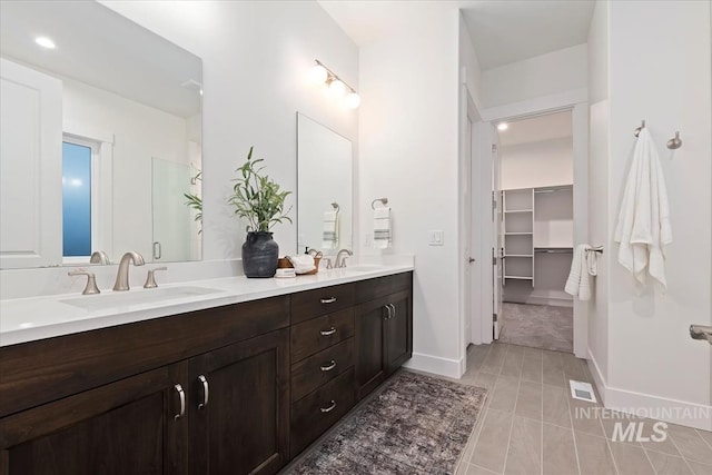 2568 N Heirloom Ave, Eagle, ID 83616 - full bath featuring tile patterned floors, double vanity, a spacious closet, recessed lighting, and baseboards