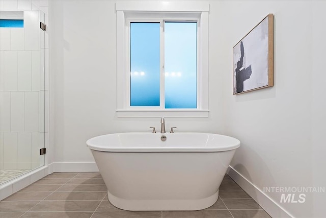 2568 N Heirloom Ave, Eagle, ID 83616 - full bathroom with baseboards, a stall shower, tile patterned flooring, and a freestanding bath