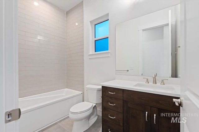 full bathroom featuring tiled shower / bath combo, vanity, toilet, and tile patterned flooring