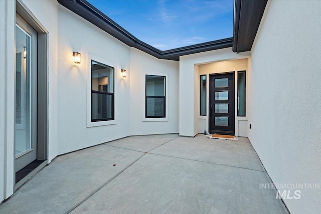 property entrance with a patio