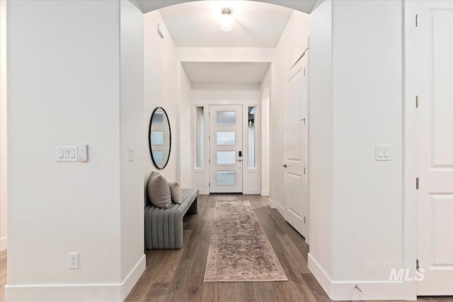 hall with dark hardwood / wood-style flooring
