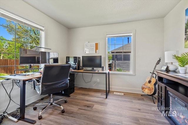2706 W Ponderosa Rd, Boise, ID 83705 - home office with baseboards and wood finished floors