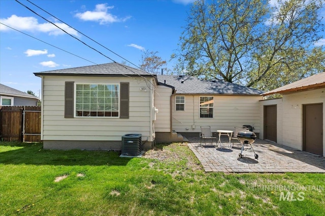 2706 W Ponderosa Rd, Boise, ID 83705 - rear view of house featuring central air condition unit, a patio, a yard, and fence