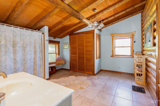 39055 Hilltop Ln, Lewiston, ID 83501 - bathroom with wood ceiling, a chandelier, vanity, tile patterned flooring, and baseboards