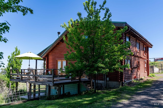 39055 Hilltop Ln, Lewiston, ID 83501 - rear view of property with log exterior, a deck, a yard, and french doors