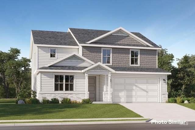 craftsman-style house with a front yard and a garage