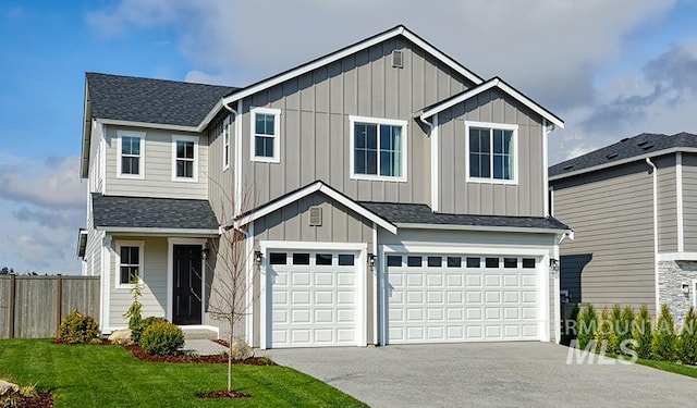 6135 N Senita Hills Ave, Meridian, ID 83646 - view of front of home with driveway, board and batten siding, a shingled roof, fence, and a garage